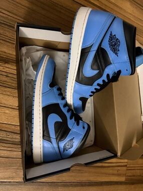 Jordan Men’s High-Top Sneakers in Light Blue and Black.
